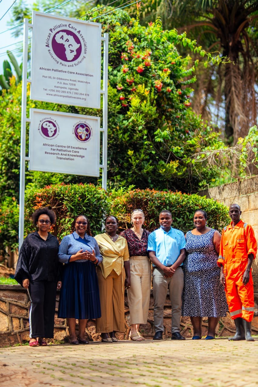 Jill Clements and Josephine Abalo of the Embassy of Ireland in Uganda with APCA staff outside the APCA offices in Kampala