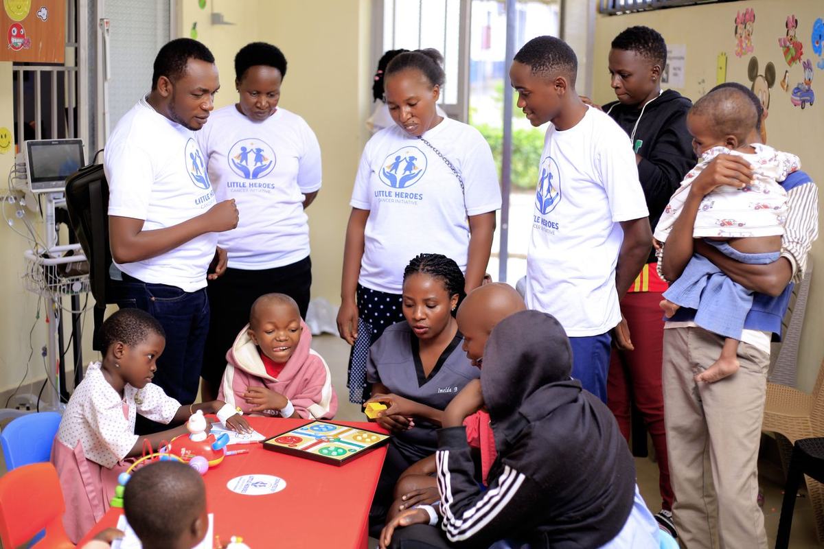 The care team and children share games at Mbarara Regional Referral Hospital.