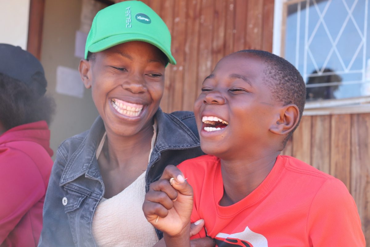 First place: a mother and her son share a moment of laughter during a fortified food distribution programme, Zimbabwe